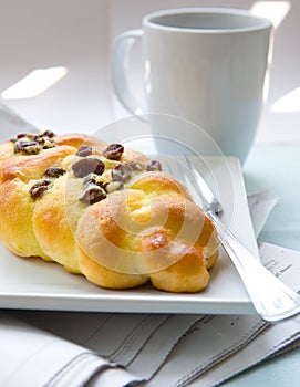 Twisted bun with raisin for breakfast