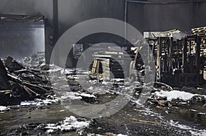 Twisted burnt rubble from warehouse fire