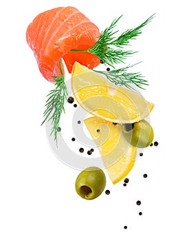 Twisted juicy salmon slice with slices of lemon and olives