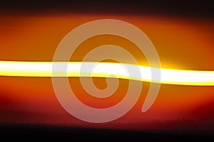 Twisted lines on evening sky after color sunset