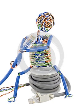 Twisted man looks on patch cable