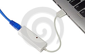 Twisted pair ethernet network cable connected to laptop