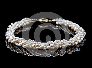 Twisted pearl necklace on black background