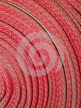 Twisted red fire hose.