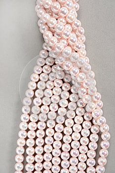Twisted strands of pink pearls