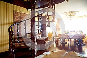 Twisted wooden staircase in the apartment