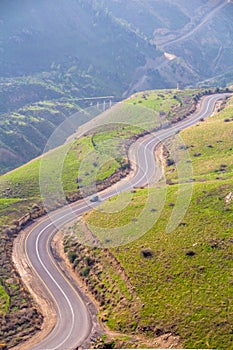 Twisting asphalt road on the border between Israel and Jordan