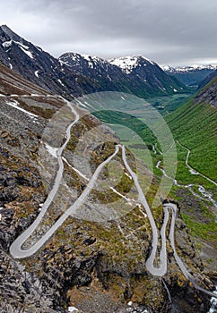 A twisty epic Trollstigen road down the mountain into the valley in Norway