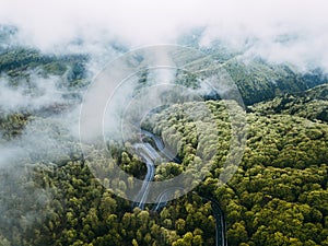 Twisty mountain road, seen from above. Aerial view