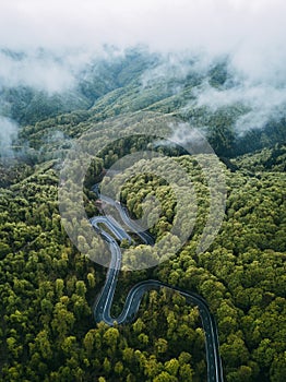 Twisty mountain road, seen from above. Aerial view
