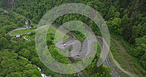 Twisty serpentine road seen from above.