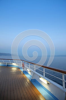 Twlight over a cruise ship deck; a relaxing way to travel, sailing across the calm ocean