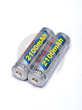 Two AA rechargeable batteries on a white background