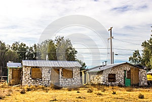 Two Abandoned Homes With Rock Fronts