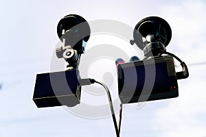 Two action camera for CCTV front of car.