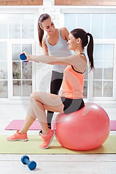 Two active women training with fitball