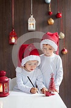 Two adorable boys, writing letter to Santa