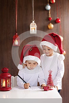 Two adorable boys, writing letter to Santa