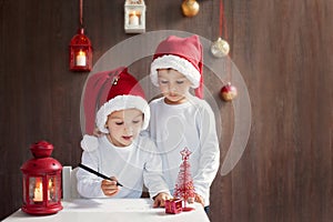 Two adorable boys, writing letter to Santa