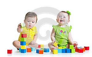 Two adorable kids playing with toys. Toddlers girl