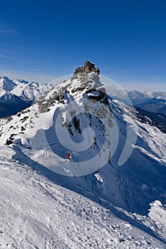 Two advanced skiers doing free ride at the off piste area at the Meribel ski resort.