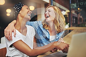 Two affectionate multiracial women friends