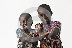 Two African children showing their palms asking begging for some