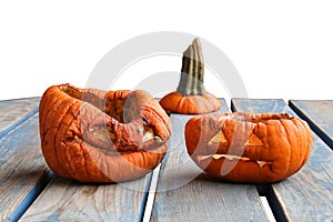 Two aged pumkins on a table