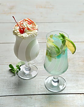 Two alcohol margarita martini cocktail and milkshake composition