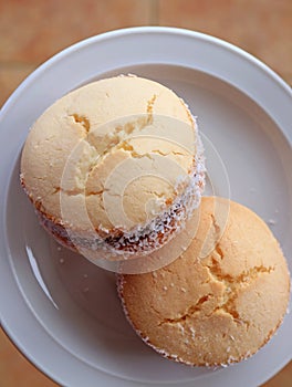 Two Alfajores, traditional Latin American sweets served on a white plate