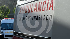 Two ambulances in a row with the sign `ambulance transfer unit` in Spanish photo