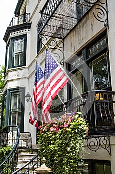 Two American Flags on Old Classic Home