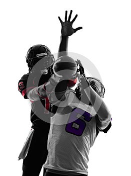 Two american football players pass action silhouette