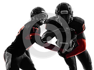 Two american football players passing play action silhouette