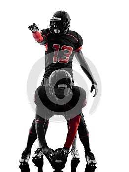 Two american football players on scrimmage silhouette