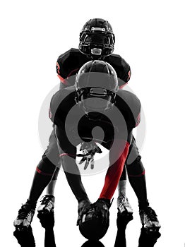 Two american football players on scrimmage silhouette