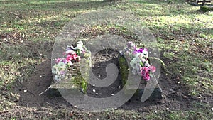 Two ancient All Souls Day grave in rural cemetery