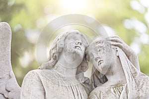 Two angels in backlit