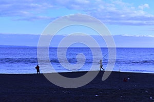 Two anglers on the jumpai beach Bali