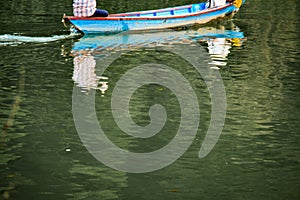 Two anglers on the Phewa lake