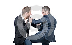 two angry businessmen fighting and arguing having struggle for leadership, business conflict.