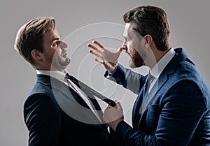 two angry businessmen fighting and arguing having struggle for leadership, rivalry.