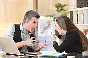 Two angry businesspeople arguing furious