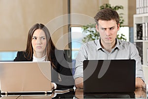 Two angry businesspeople disputing photo