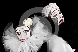 Two angry clowns with black background