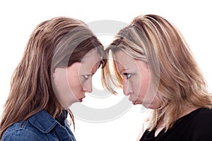 Two angry woman faces each other