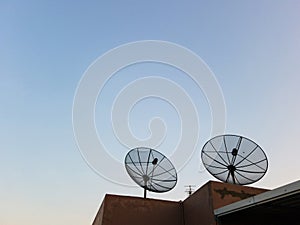 Two Antenna communication satellite dish on top of the building