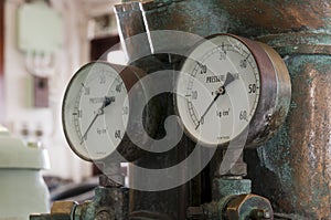 Two antique pressure gauges