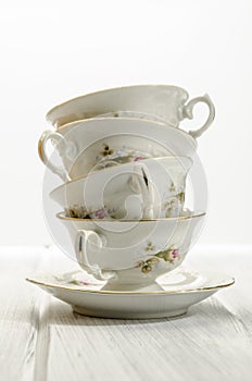 two antique teacups on white background