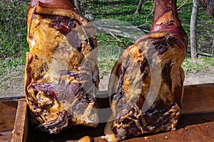 Two appetizing homemade smoked pork hams